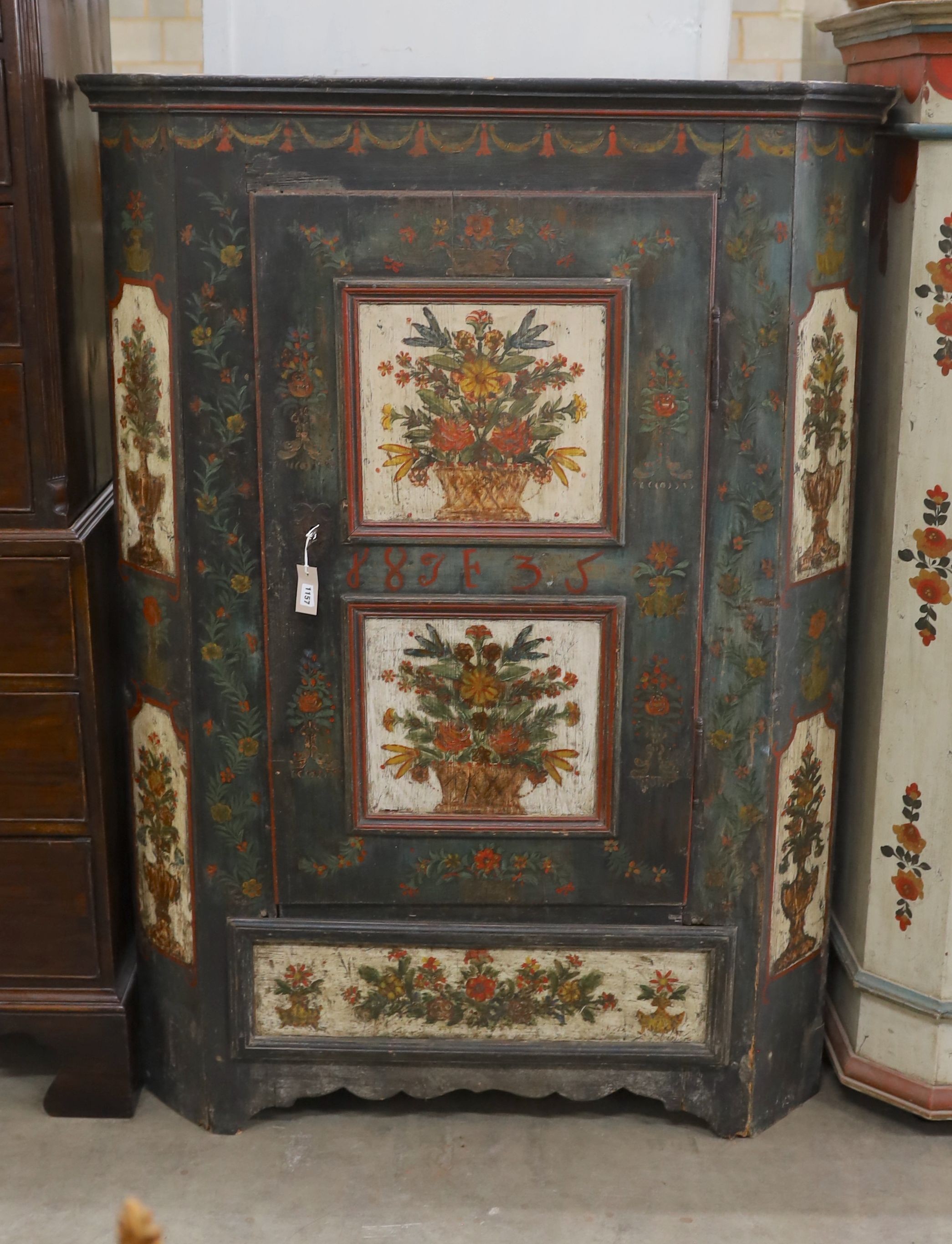 An early 19th century Tyrolean green painted pine armoire, width 117cm, depth 53cm, height 165cm